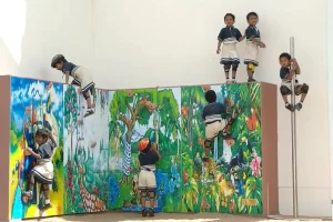 a group of children climbing on a wall